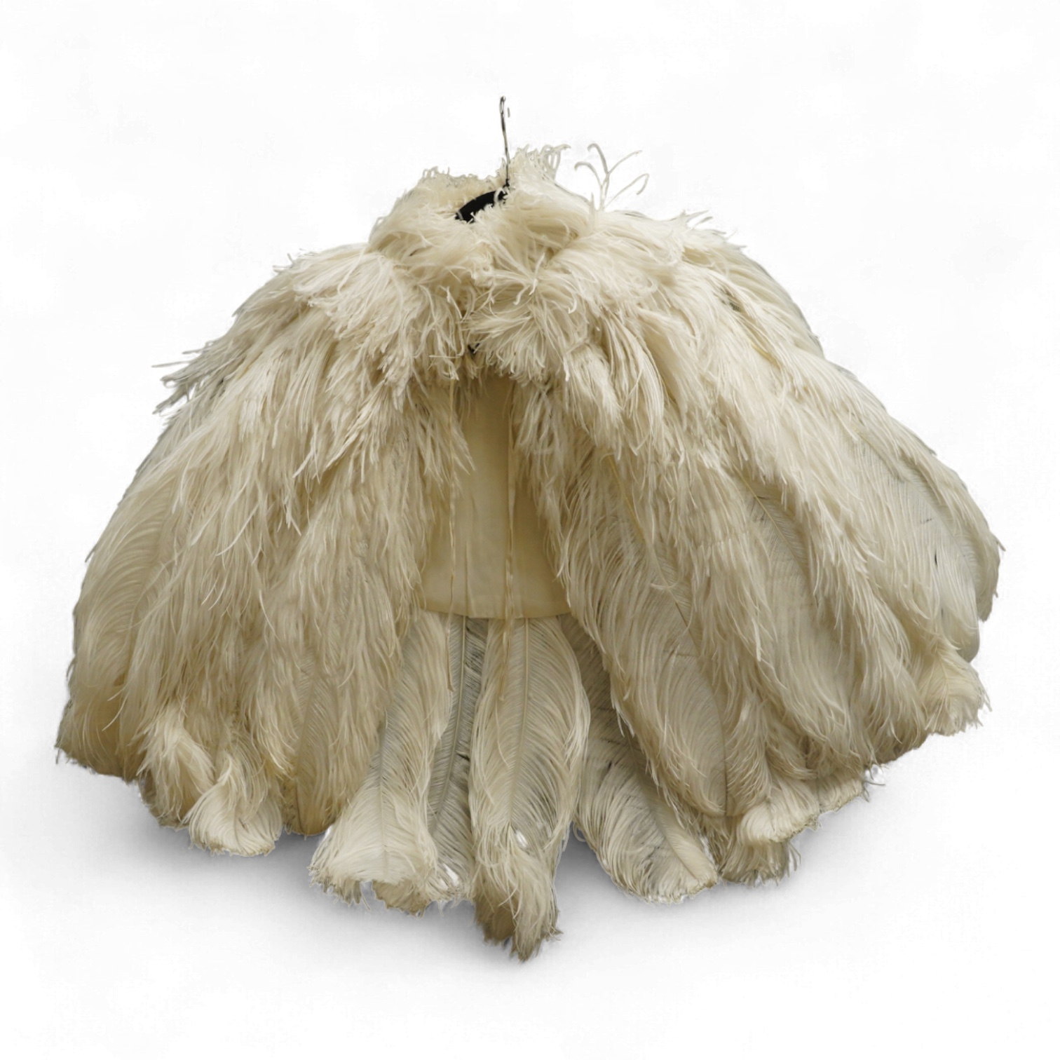 A 1930’s white Ostrich feather evening cape, with small feather stand up collar half lined in georgette.667cm long from top of collar to base. Condition - good - may need professional cleaning.